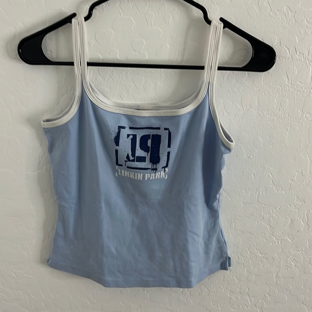 Light blue tank top. Size large in excellent condition. Graphic design on front.